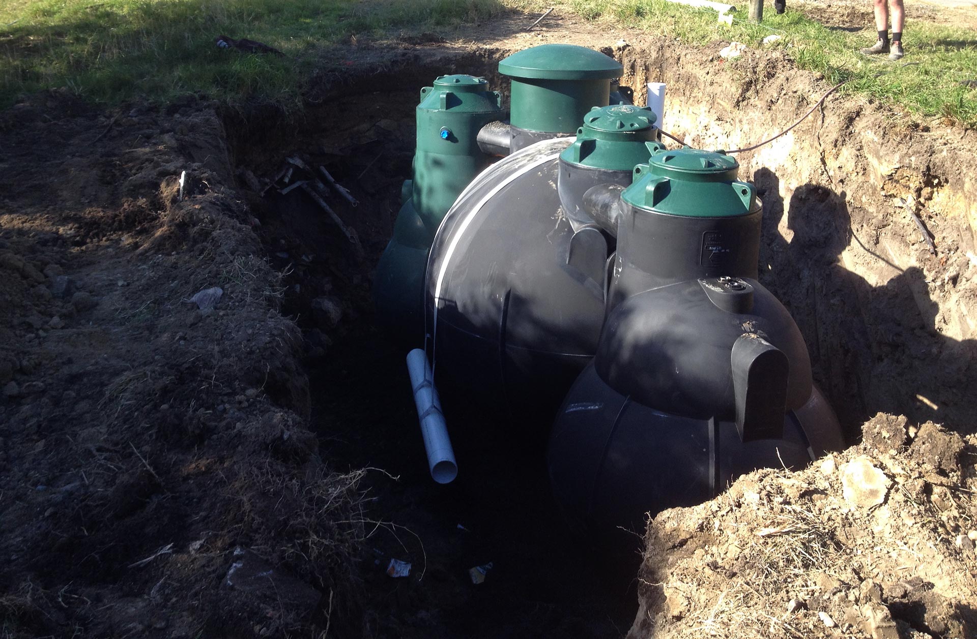 Cape Plumbing installing septic tank in ground